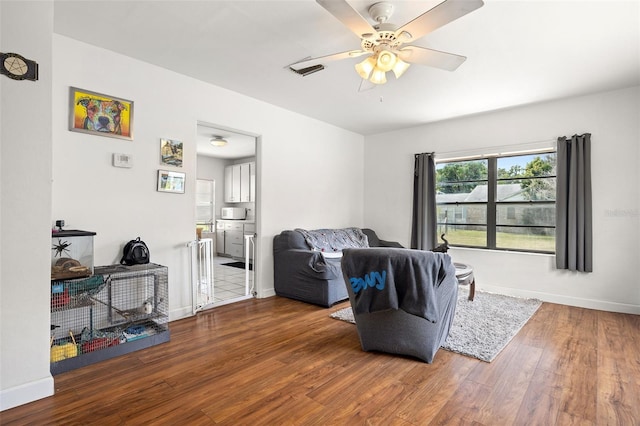 750 N Kentucky Ave, Umatilla, FL 32784 - living room with wood finished floors and a ceiling fan