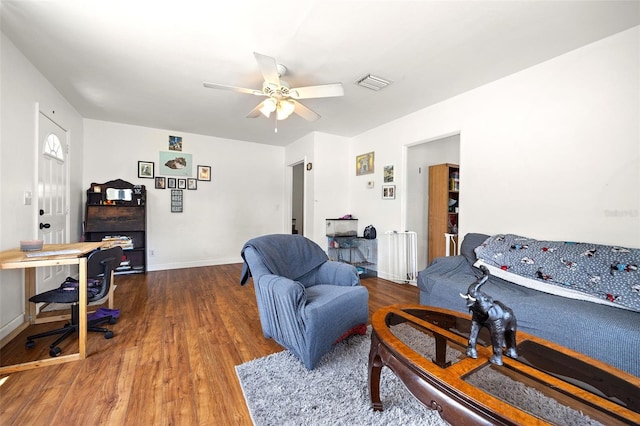 750 N Kentucky Ave, Umatilla, FL 32784 - living area with wood finished floors, ceiling fan, and a desk
