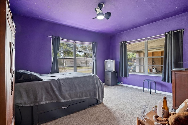 750 N Kentucky Ave, Umatilla, FL 32784 - bedroom featuring carpet, a ceiling fan, and a textured wall