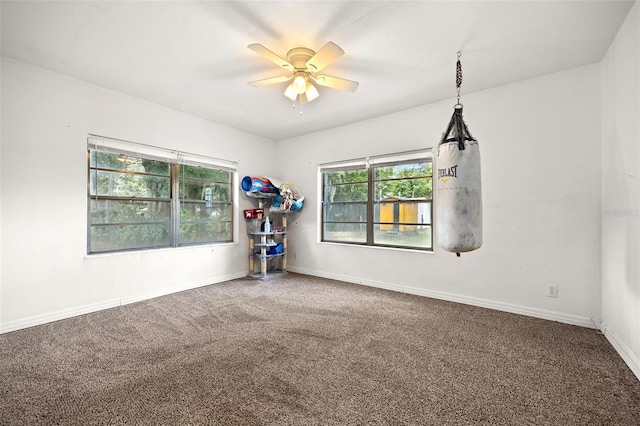 750 N Kentucky Ave, Umatilla, FL 32784 - empty room with a ceiling fan and carpet flooring