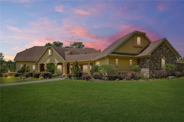 view of property featuring a lawn