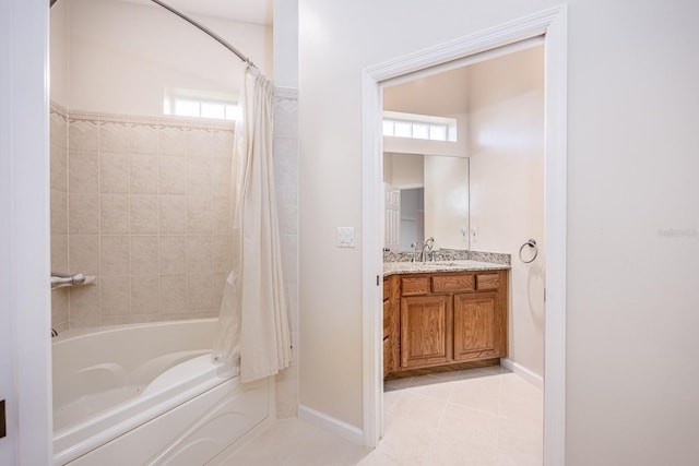 bathroom featuring a healthy amount of sunlight, shower / bath combo with shower curtain, vanity, and tile flooring