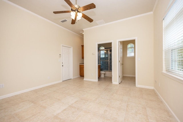 unfurnished bedroom with ornamental molding, light tile flooring, and ensuite bath