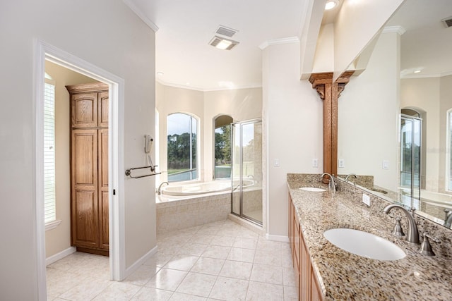 bathroom featuring ornamental molding, dual bowl vanity, tile floors, and plus walk in shower