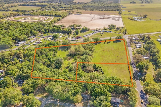 birds eye view of property with a rural view