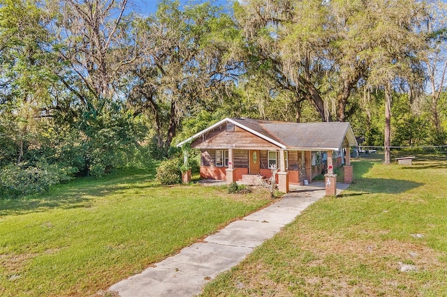 view of front facade with covered porch and a front yard