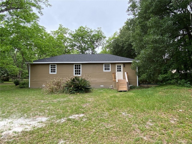 view of property exterior with a yard