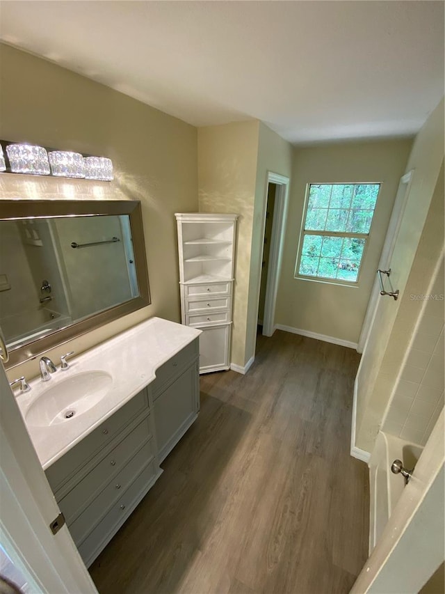 bathroom featuring vanity and hardwood / wood-style flooring