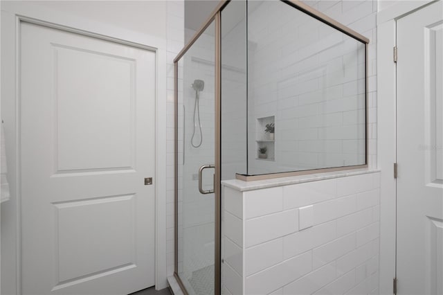 bathroom featuring an enclosed shower