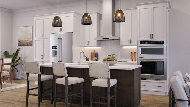 kitchen featuring white cabinetry, wall chimney exhaust hood, light hardwood / wood-style floors, and appliances with stainless steel finishes