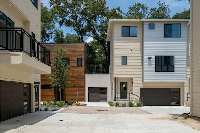 contemporary house with a balcony and a garage