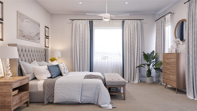 bedroom featuring light carpet and ceiling fan