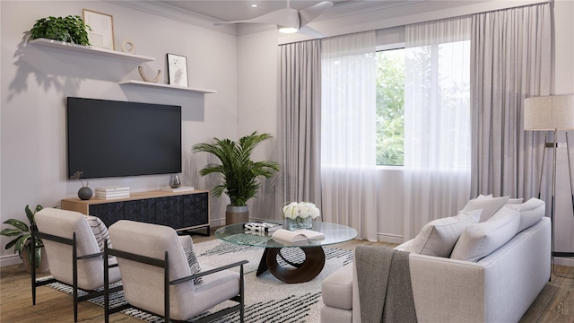 living room featuring hardwood / wood-style flooring, ceiling fan, and crown molding