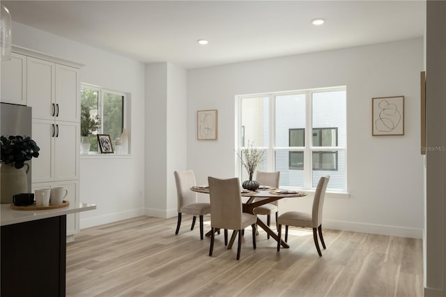 dining room with light wood-type flooring