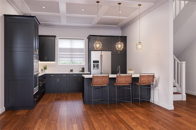 kitchen with high end refrigerator, dark hardwood / wood-style floors, tasteful backsplash, decorative light fixtures, and a kitchen island