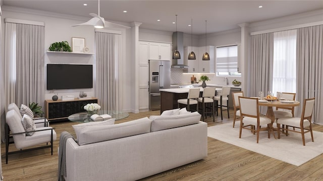 living room featuring crown molding and light hardwood / wood-style floors