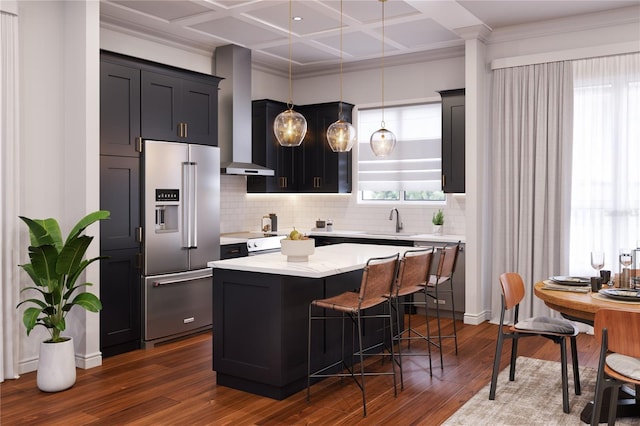 kitchen with coffered ceiling, high end refrigerator, a kitchen breakfast bar, hanging light fixtures, and dark hardwood / wood-style flooring