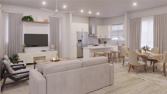 living room with sink and light wood-type flooring