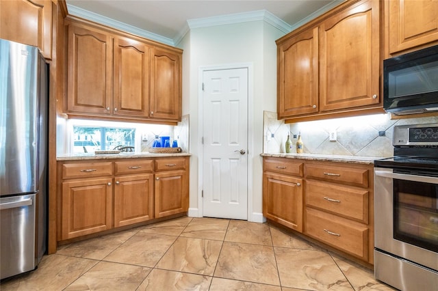 kitchen with backsplash, light stone counters, crown molding, and appliances with stainless steel finishes