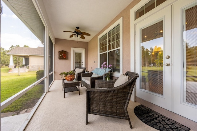 sunroom / solarium with ceiling fan