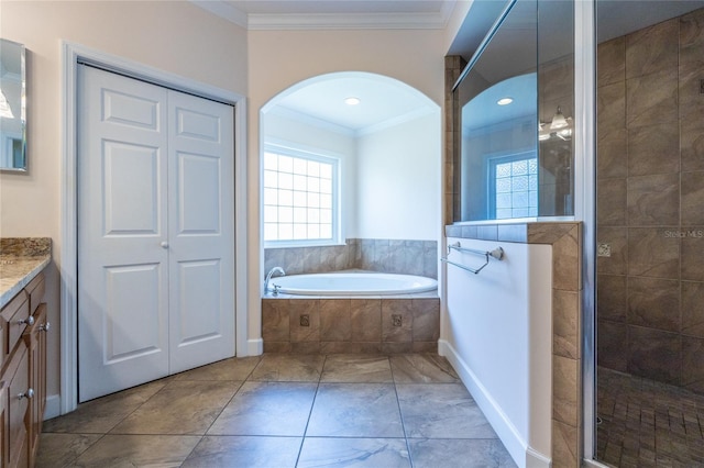 bathroom with vanity, shower with separate bathtub, and ornamental molding