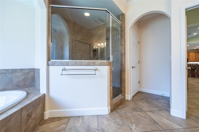 bathroom featuring crown molding and independent shower and bath