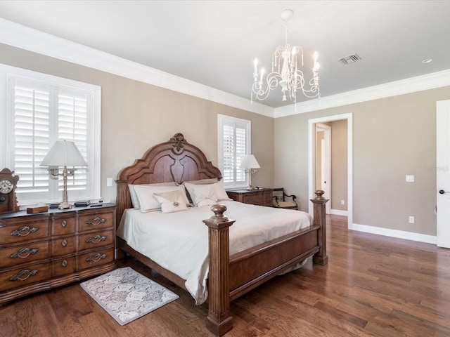 bedroom with dark wood-type flooring, a notable chandelier, and crown molding