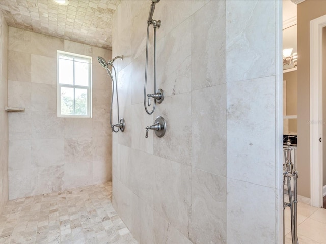 bathroom with a tile shower