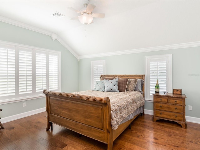 bedroom with lofted ceiling, ceiling fan, ornamental molding, and dark wood-type flooring