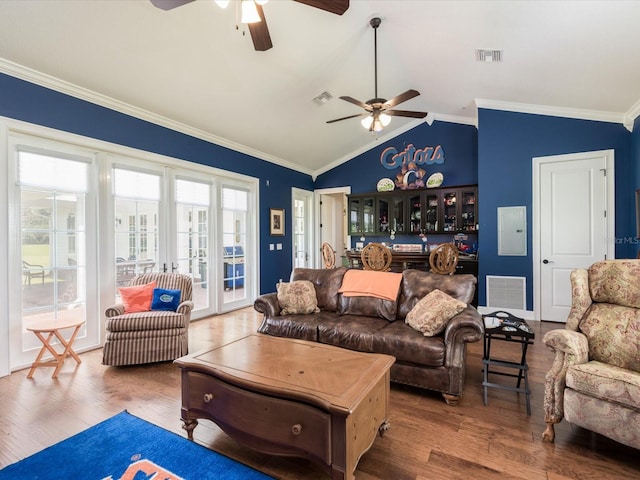 living room with ornamental molding, vaulted ceiling, ceiling fan, and dark hardwood / wood-style floors