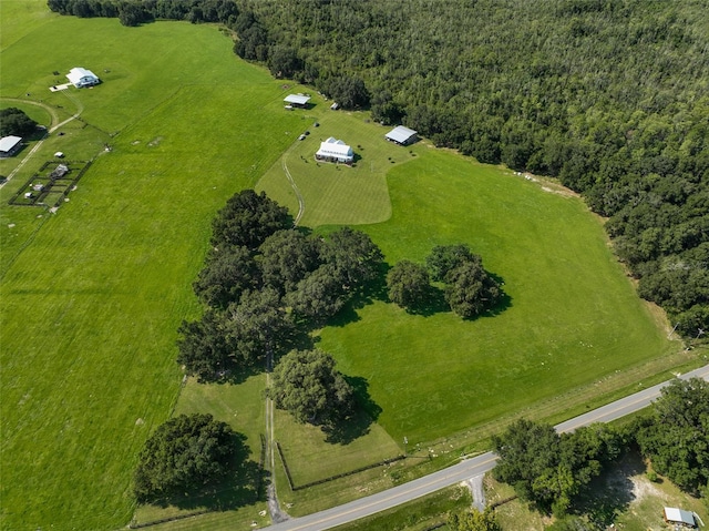 birds eye view of property with a rural view