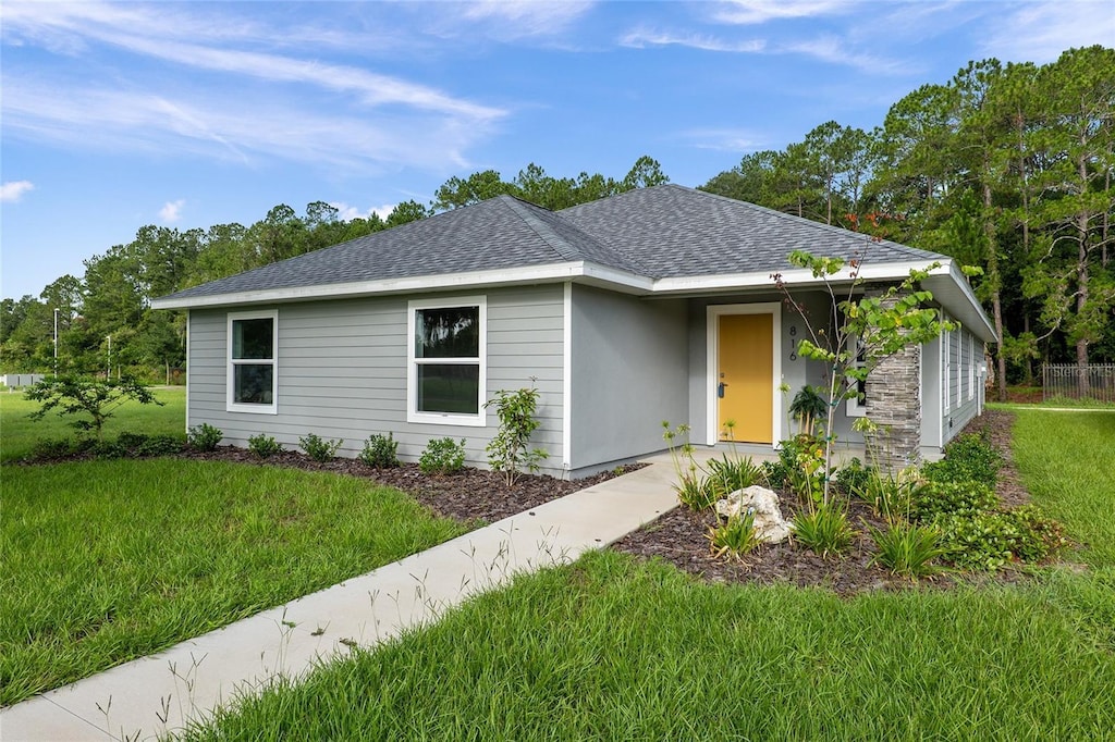 ranch-style house with a front yard