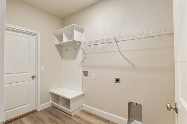 laundry room with hookup for an electric dryer, hookup for a washing machine, and hardwood / wood-style floors