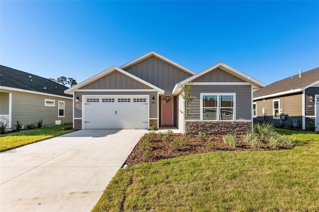 craftsman-style home featuring a garage and a front yard