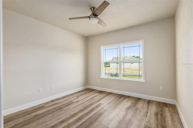 unfurnished room with ceiling fan and light hardwood / wood-style flooring