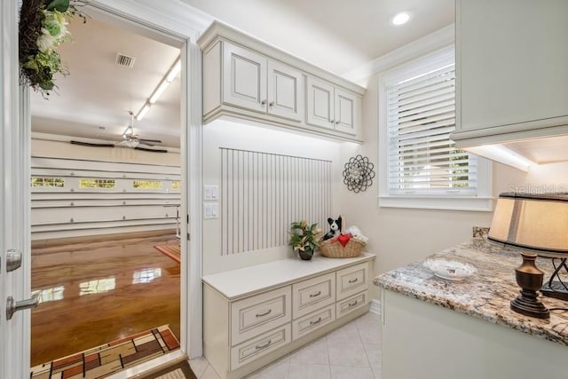 mudroom featuring ceiling fan, light tile patterned floors, and track lighting