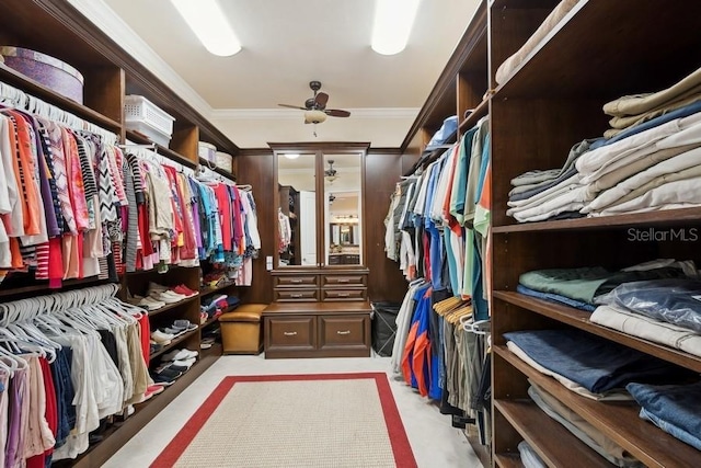 walk in closet with ceiling fan