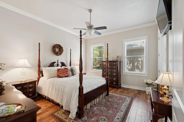 bedroom with ceiling fan, dark hardwood / wood-style floors, and crown molding