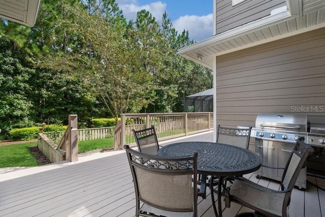 wooden terrace featuring grilling area