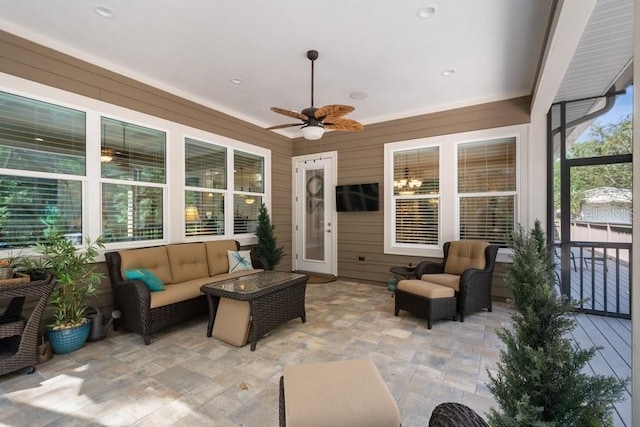 sunroom / solarium with ceiling fan