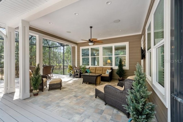 sunroom with ceiling fan