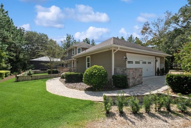 view of home's exterior with a garage and a yard