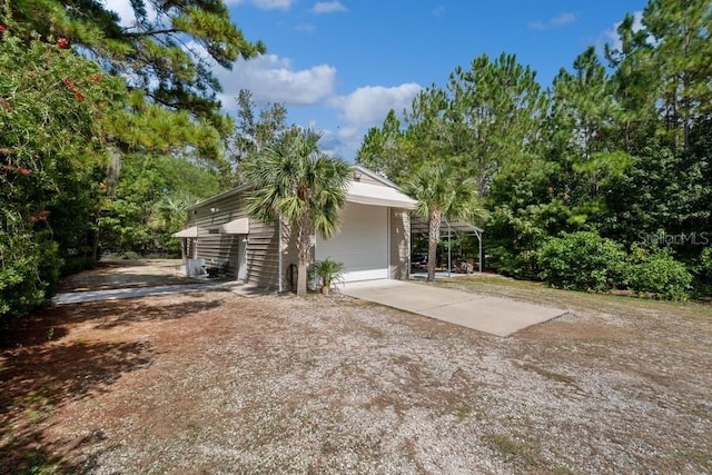 view of home's exterior featuring a carport