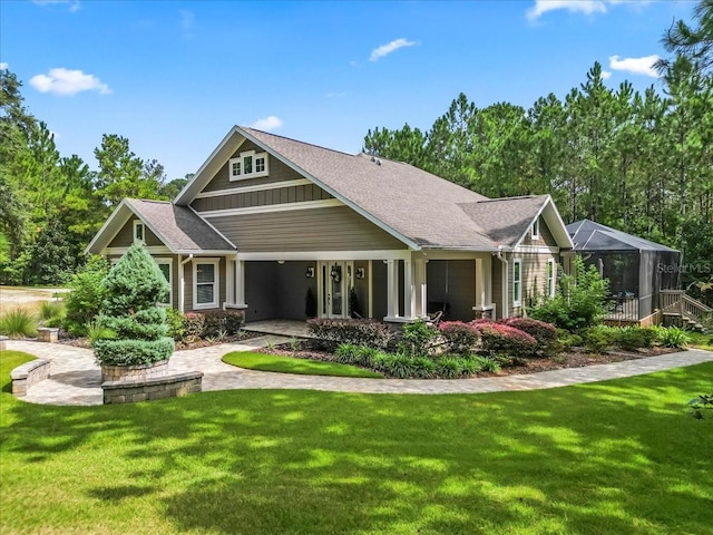 rear view of house featuring a yard