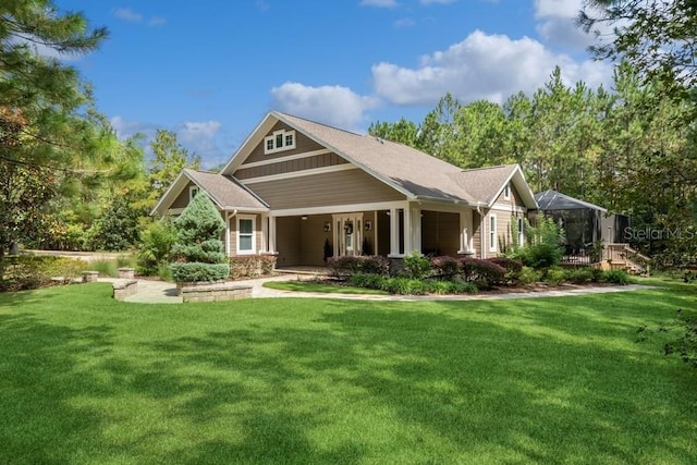 view of front of property with a front yard and covered porch