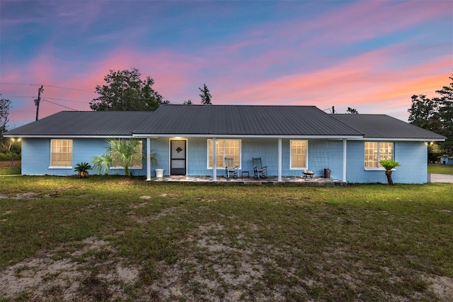 ranch-style house with a yard