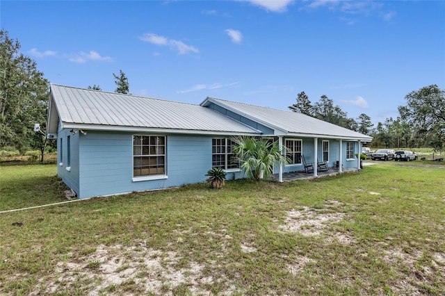 back of house with a yard