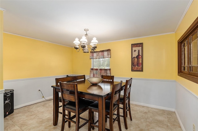 dining room with a notable chandelier and ornamental molding