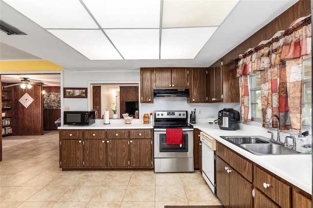 kitchen with dark brown cabinets, dishwasher, sink, light tile patterned floors, and stainless steel electric range