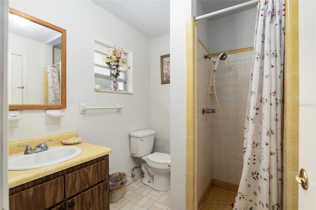 bathroom with walk in shower, vanity, toilet, and a textured ceiling